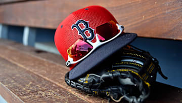 Mar 5, 2019; West Palm Beach, FL, USA; A detailed view of a Boston Red Sox cap, sunglasses and glove in the dugout  during a spring training game between the Washington Nationals and the Boston Red Sox at FITTEAM Ballpark of the Palm Beaches. Mandatory Credit: Jasen Vinlove-Imagn Images