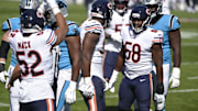 Oct 18, 2020; Charlotte, North Carolina, USA; Chicago Bears inside linebacker Roquan Smith (58) reacts with outside linebacker Khalil Mack (52) after a sack in the first quarter at Bank of America Stadium. Mandatory Credit: Bob Donnan-Imagn Images