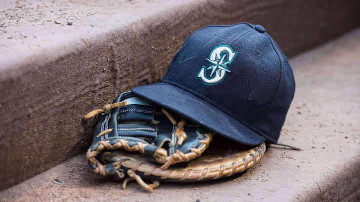 Aug 18, 2015; Arlington, TX, USA; A view of a Seattle Mariners ball cap and glove during the game between the Texas Rangers and the Seattle Mariners at Globe Life Park in Arlington. The Mariners defeat the Rangers 3-2. Mandatory Credit: Jerome Miron-Imagn Images