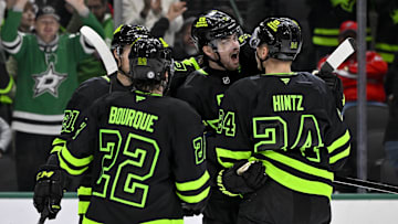 Dec 16, 2024; Dallas, Texas, USA; Dallas Stars center Mavrik Bourque (22) and defenseman Lian Bichsel (6) and center Roope Hintz (24) celebrates a goal scored by Bichsel against the Washington Capitals during the second period at the American Airlines Center. Mandatory Credit: Jerome Miron-Imagn Images