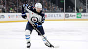 Apr 1, 2025; Los Angeles, California, USA;  Winnipeg Jets left wing Nikolaj Ehlers (27) skates with the puck during the third period against the Los Angeles Kings at Crypto.com Arena. Mandatory Credit: Kiyoshi Mio-Imagn Images
