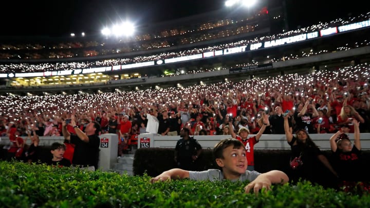 Georgia fans light up Sanford Stadium as the game goes into the fourth during the second half of a NCAA college football game against Tennessee Martin in Athens, Ga., on Saturday, Sept. 2, 2023. Georgia won 48-7.