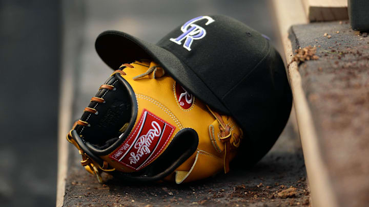 Colorado Rockies baseball hat and glove.
