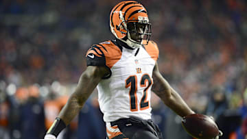 Dec 28, 2015; Denver, CO, USA; Cincinnati Bengals wide receiver Mohamed Sanu (12) carries for a touchdown in the second quarter against the Denver Broncos at Sports Authority Field at Mile High. Mandatory Credit: Ron Chenoy-Imagn Images