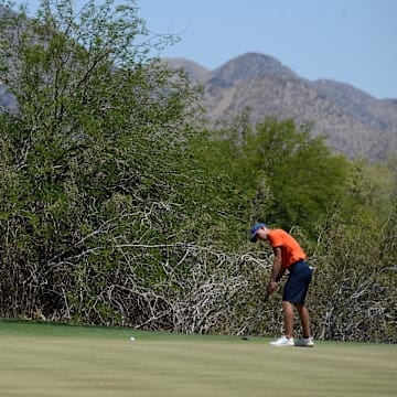 May 31, 2021; Scottsdale, Arizona, USA; University of Illinois golfer Michael Feagles putts on the ninth green during the NCAA Men's Golf Championship at Grayhawk Golf Club. Mandatory Credit: Joe Camporeale-Imagn Images