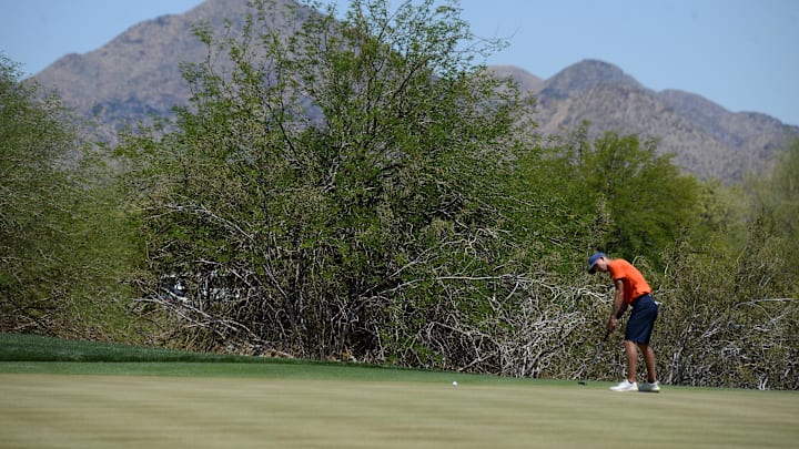 May 31, 2021; Scottsdale, Arizona, USA; University of Illinois golfer Michael Feagles putts on the ninth green during the NCAA Men's Golf Championship at Grayhawk Golf Club. Mandatory Credit: Joe Camporeale-Imagn Images