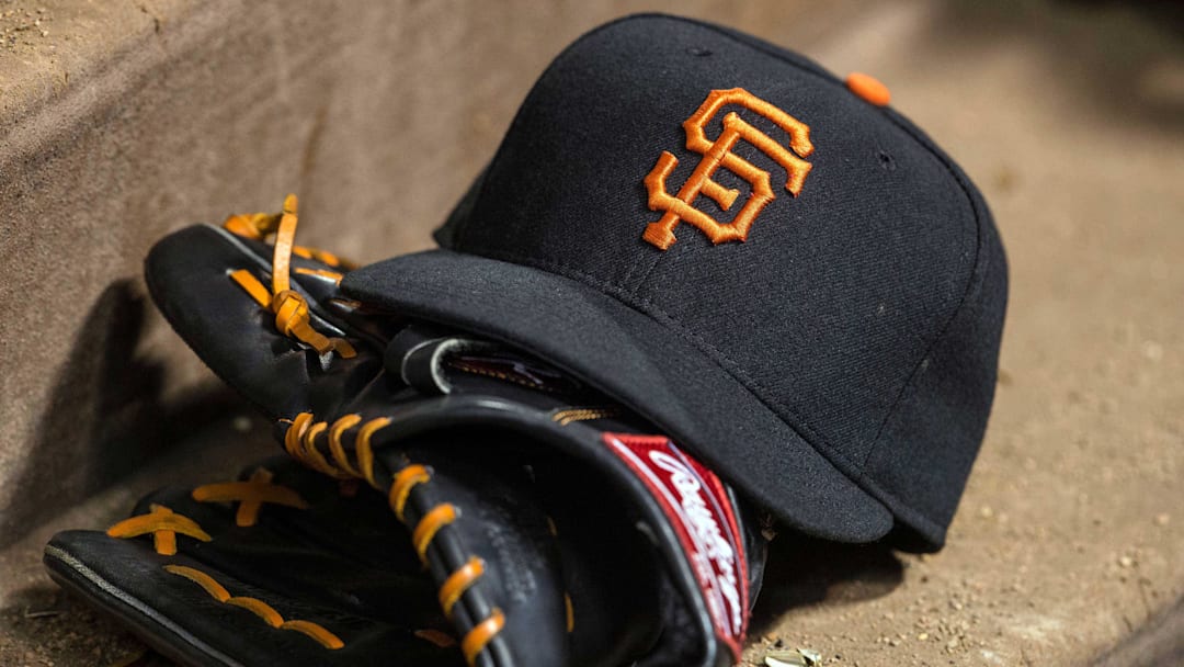 Jul 31, 2015; Arlington, TX, USA; A view of a San Francisco Giants baseball hat and glove during the game between the Texas Rangers and the San Francisco Giants at Globe Life Park in Arlington. The Rangers defeated the Giants 6-3. Mandatory Credit: Jerome Miron-Imagn Images