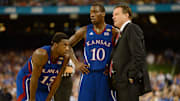 Apr 2, 2012; New Orleans, LA, USA; Kansas Jayhawks head coach Bill Self talks with guard Tyshawn Taylor (10) and guard Elijah Johnson (15) during the second half in the finals of the 2012 NCAA men's basketball Final Four against the Kentucky Wildcats at the Mercedes-Benz Superdome. 