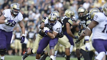 Nov 17, 2012; Boulder, CO, USA; Washington Huskies wide receiver Kendyl Taylor (23) runs for a large gain in the fourth quarter of the game against the Colorado Buffaloes at Folsom Field. The Huskies defeated the Buffaloes 38-3. Mandatory Credit: Ron Chenoy-Imagn Images