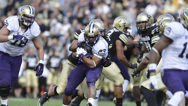 Nov 17, 2012; Boulder, CO, USA; Washington Huskies wide receiver Kendyl Taylor (23) runs for a large gain in the fourth quarter of the game against the Colorado Buffaloes at Folsom Field. The Huskies defeated the Buffaloes 38-3. Mandatory Credit: Ron Chenoy-Imagn Images