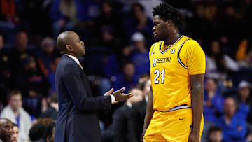Missouri Tigers center Peyton Marshall (21) talks to his head coach Dennis Gates, in a game versus the Florida Gators last season.