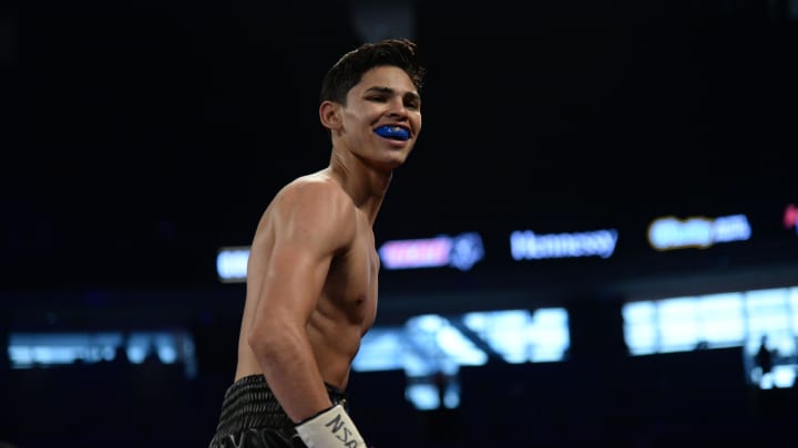 Ryan Garcia (black/gold trunks) reacts after defeating Tyrone Luckey  in their lightweight bout at T-Mobile Arena (2017). 