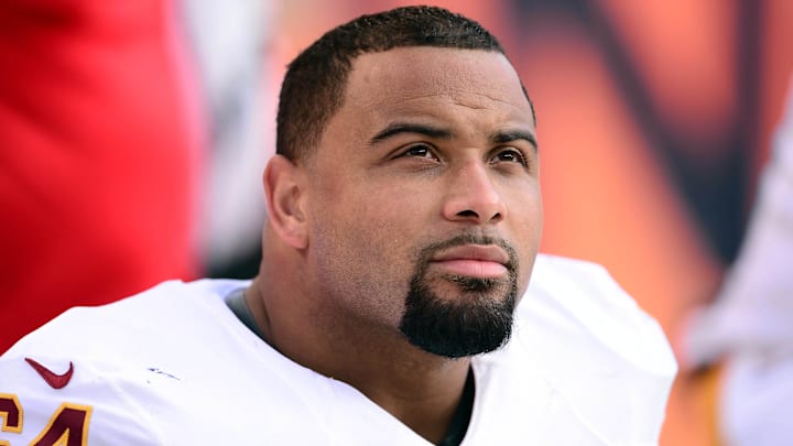 Oct 27, 2013; Denver, CO, USA; Washington Redskins defensive end Kedric Golston (64) on the bench in the fourth quarter against the Denver Broncos at Sports Authority Field at Mile High. Mandatory Credit: Ron Chenoy-Imagn Images