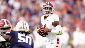 Nov 25, 2023; Auburn, Alabama, USA; Alabama Crimson Tide quarterback Jalen Milroe (4) looks to pass against the Auburn Tigers during the second quarter at Jordan-Hare Stadium. Mandatory Credit: John David Mercer-Imagn Images
