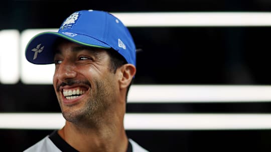 May 5, 2024; Miami Gardens, Florida, USA; RB driver Daniel Ricciardo (3) walks in the paddock before the F1 Miami Grand Prix at Miami International Autodrome.