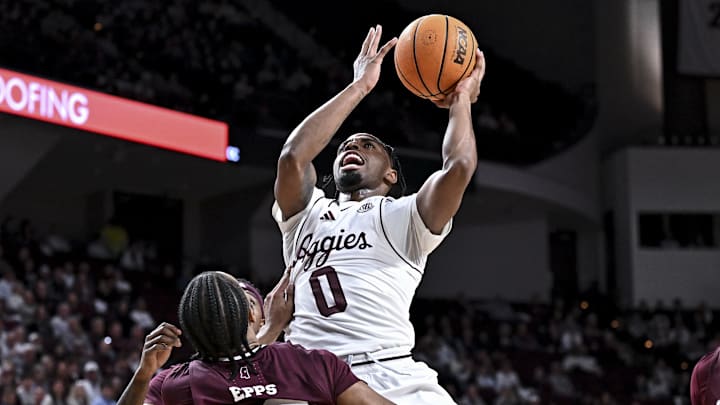 Jan 21, 2026; College Station, Texas, USA; Texas A&M Aggies guard Marcus Hill (0) shoots the ball against the Mississippi State Bulldogs during the first half at Reed Arena. Mandatory Credit: Maria Lysaker-Imagn Images 