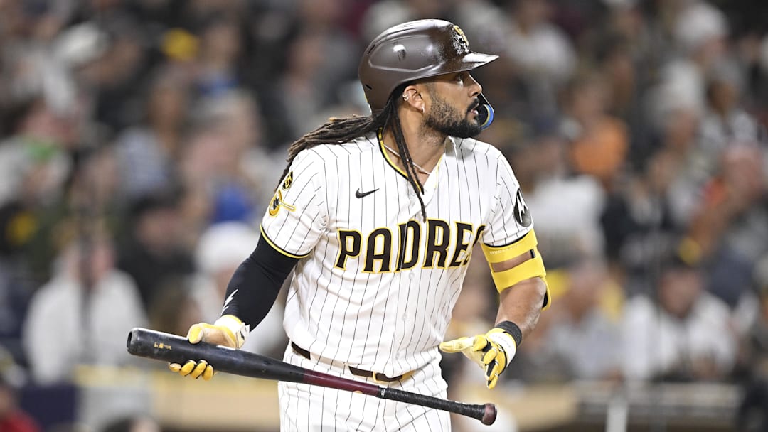 Fernando Tatis Jr. (23) hits a sacrifice fly ball during the third inning against the Colorado Rockies at Petco Park. Fernando Tatis Jr. (23) hits a sacrifice fly ball during the third inning against the Colorado Rockies at Petco Park.