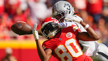 Oct 19, 2025; Kansas City, Missouri, USA; Las Vegas Raiders cornerback Darnay Holmes (30) breaks up a pass intended for Kansas City Chiefs wide receiver Tyquan Thornton (80) during the second quarter of the game at GEHA Field at Arrowhead Stadium.