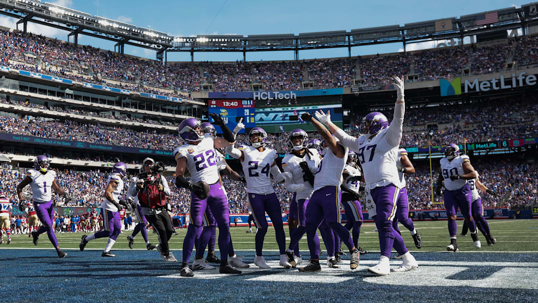 Sep 8, 2024; East Rutherford, New Jersey, USA; Minnesota Vikings safety Harrison Smith (22) celebrates his interception with teammates during the second half against the New York Giants at MetLife Stadium. Mandatory Credit: Vincent Carchietta-Imagn Images