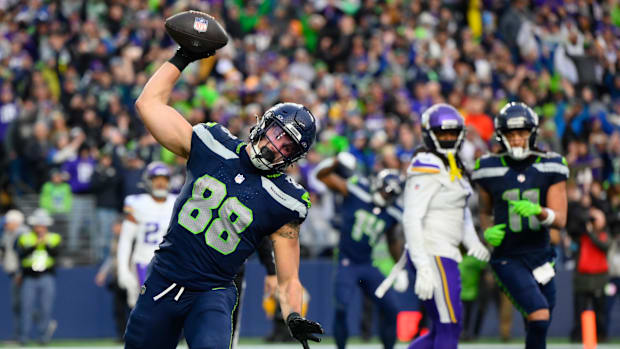Seattle Seahawks tight end AJ Barner (88) spikes the ball after scoring a touchdown
