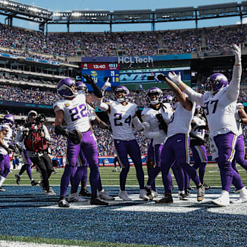 Sep 8, 2024; East Rutherford, New Jersey, USA; Minnesota Vikings safety Harrison Smith (22) celebrates his interception with teammates during the second half against the New York Giants at MetLife Stadium.