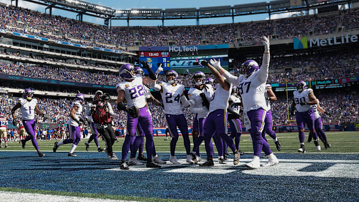 Sep 8, 2024; East Rutherford, New Jersey, USA; Minnesota Vikings safety Harrison Smith (22) celebrates his interception with teammates during the second half against the New York Giants at MetLife Stadium.