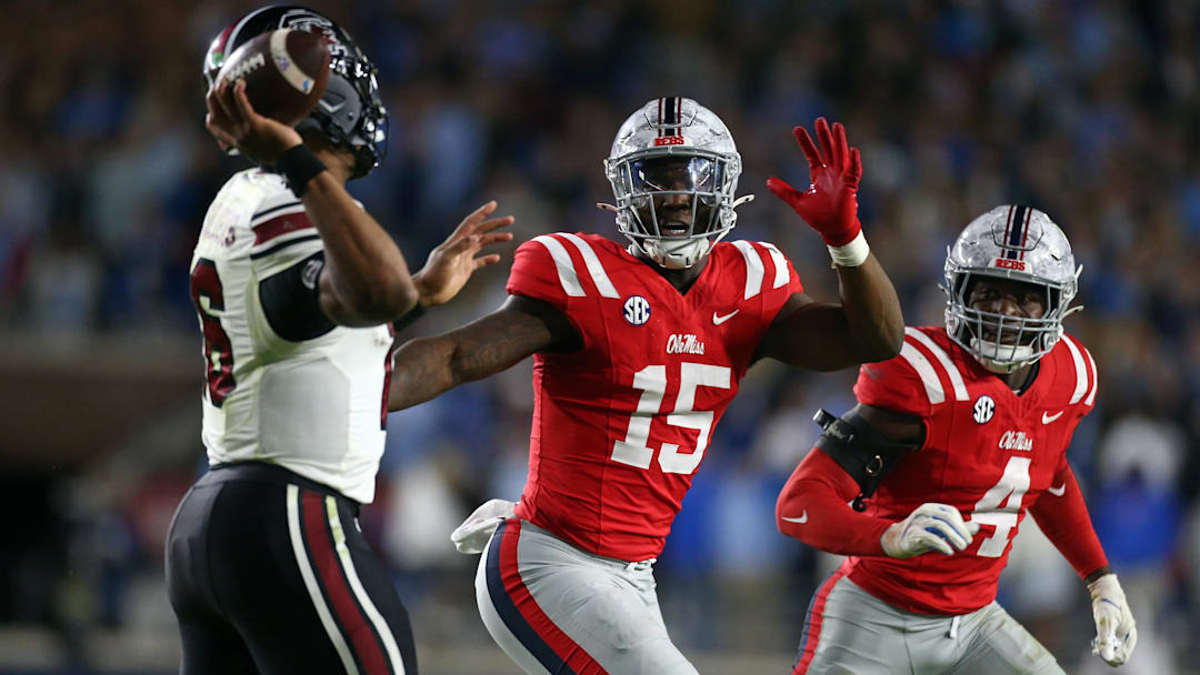Nov 1, 2025; Oxford, Mississippi, USA; Mississippi Rebels defensive lineman Da'Shawn Womack (15) and Mississippi Rebels linebacker Suntarine Perkins (4) rush South Carolina Gamecocks quarterback LaNorris Sellers (16) during the fourth quarter at Vaught-Hemingway Stadium. Mandatory Credit: Petre Thomas-Imagn Images