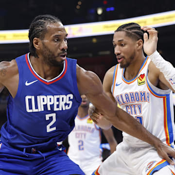 Feb 22, 2024; Oklahoma City, Oklahoma, USA; LA Clippers forward Kawhi Leonard (2) drives to the basket against Oklahoma City Thunder guard Aaron Wiggins (21) during the second half at Paycom Center. Mandatory Credit: Alonzo Adams-Imagn Imagesf