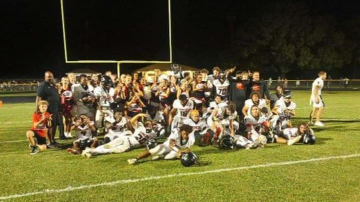 Dunedin High School's football team celebrating win over Countryside in Week 1