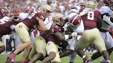 Aug 30, 2025; Tallahassee, Florida, USA; Alabama Crimson Tide running back Richard Young (9) runs with the ball against Florida State Seminoles defensive back Earl Little Jr. (0) during the first half at Doak S. Campbell Stadium. Mandatory Credit: Melina Myers-Imagn Images