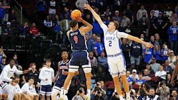 Mar 27, 2025; Newark, NJ, USA; Arizona Wildcats forward Carter Bryant (9) shoots the ball against Duke Blue Devils forward Cooper Flagg (2) during the second half during an East Regional semifinal of the 2025 NCAA tournament at Prudential Center. Mandatory Credit: Robert Deutsch-Imagn Images