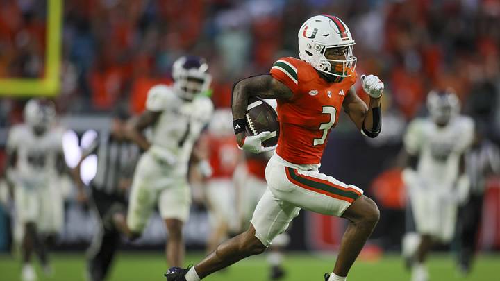 Sep 9, 2023; Miami Gardens, Florida, USA; Miami Hurricanes wide receiver Jacolby George (3) runs with the football for a touchdown against the Texas A&M Aggies during the fourth quarter at Hard Rock Stadium. Mandatory Credit: Sam Navarro-USA TODAY Sports