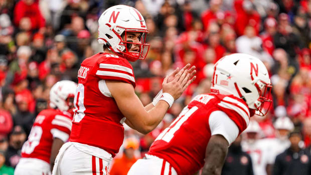 Nebraska Cornhuskers quarterback Heinrich Haarberg (10) and running back Emmett Johnson (21) 