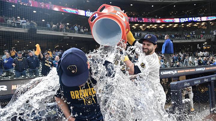 Apr 26, 2026; Milwaukee, Wisconsin, USA; Milwaukee Brewers center fielder Garrett Mitchell (5) dunks starting pitcher Kyle Harrison (52) after beating the Pittsburgh Pirates at American Family Field. Mandatory Credit: Benny Sieu-Imagn Images