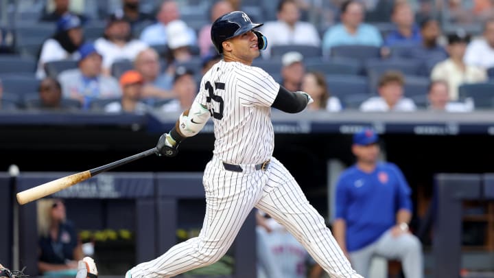 Jul 23, 2024; Bronx, New York, USA; New York Yankees second baseman Gleyber Torres (25) follows through on a solo home run during the second inning against the New York Mets at Yankee Stadium. Mandatory Credit: Brad Penner-USA TODAY Sports