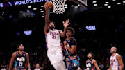 Nov 19, 2023; Brooklyn, New York, USA; Philadelphia 76ers center Joel Embiid (21) drives to the basket against Brooklyn Nets forward Cameron Johnson (2) during the first quarter at Barclays Center. Mandatory Credit: Brad Penner-Imagn Images