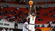 Oklahoma State Cowboys forward Marchelus Avery (0) makes a 3-pointer over Kansas State Wildcats guard Coleman Hawkins (33) during a men's BIG 12 basketball game between the Oklahoma State University Cowboys (OSU) and the Kansas State Wildcats at Gallagher-Iba Arena in Stillwater, Okla., Tuesday, Jan. 7, 2025.