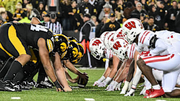 Nov 2, 2024; Iowa City, Iowa, USA; The line of scrimmage between the Iowa Hawkeyes and the Wisconsin Badgers during the fourth quarter at Kinnick Stadium. Mandatory Credit: Jeffrey Becker-Imagn Images