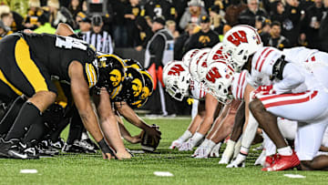 Nov 2, 2024; Iowa City, Iowa, USA; The line of scrimmage between the Iowa Hawkeyes and the Wisconsin Badgers during the fourth quarter at Kinnick Stadium. Mandatory Credit: Jeffrey Becker-Imagn Images