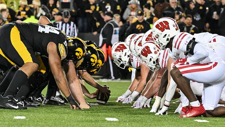 Nov 2, 2024; Iowa City, Iowa, USA; The line of scrimmage between the Iowa Hawkeyes and the Wisconsin Badgers during the fourth quarter at Kinnick Stadium. Mandatory Credit: Jeffrey Becker-Imagn Images