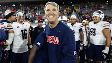 Nov 28, 2025; Tempe, Arizona, USA; Arizona Wildcats head coach Brent Brennan celebrates against the Arizona State Sun Devils during the 99th Territorial Cup at Mountain America Stadium. Mandatory Credit: Mark J. Rebilas-Imagn Images