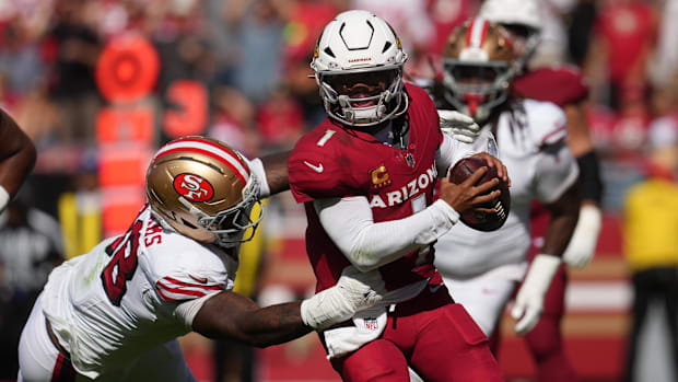 rizona Cardinals quarterback Kyler Murray (1) is pressured by San Francisco 49ers defensive end Mykel Williams (98) 