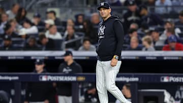 Oct 7, 2024; Bronx, New York, USA; New York Yankees manager Aaron Boone (17) walks to the mound for a pitching change against the Kansas City Royals in the sixth inning during game two of the ALDS for the 2024 MLB Playoffs at Yankee Stadium. Mandatory Credit: Brad Penner-Imagn Images