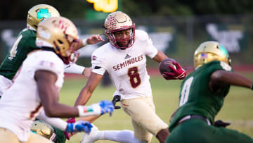 Florida State University High School Micahi Danzy (8) is pursued by the Trinity Catholic defense. The Trinity Catholic Celtics hosted the Florida State University High School at Trinity Catholic High School in Ocala, FL on Friday, September 29, 2023. [Doug Engle/Ocala Star Banner]