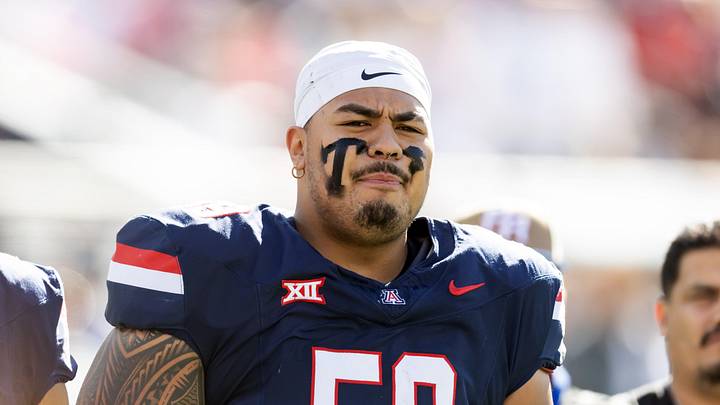 Nov 22, 2025; Tucson, Arizona, USA; Arizona Wildcats offensive lineman Rhino Tapa'atoutai (59) against the Baylor Bears at Casino Del Sol Stadium. Mandatory Credit: Mark J. Rebilas-Imagn Images