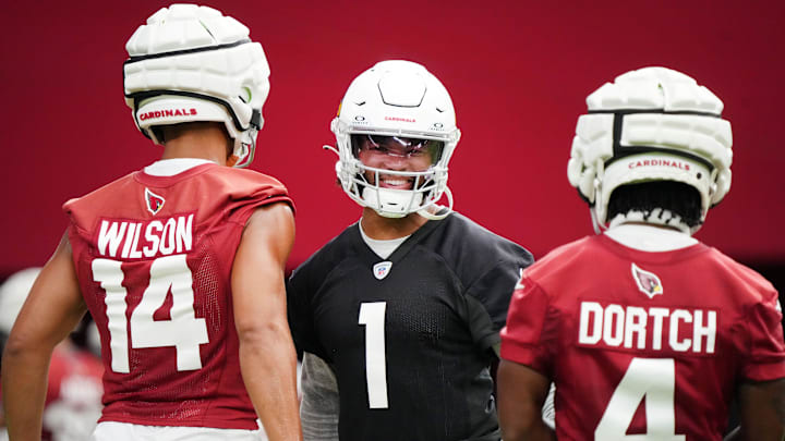 Arizona Cardinals quarterback Kyler Murray (1) practices with teammates Michael Wilson (14) and Greg Dortch (4) during the team's training camp session at State Farm Stadium in Glendale on July 24, 2024.