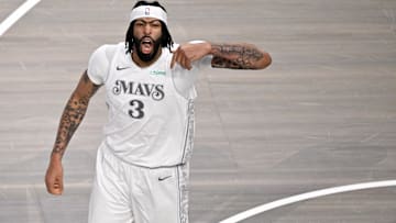Feb 8, 2025; Dallas, Texas, USA; Dallas Mavericks forward Anthony Davis (3) celebrates after he dunks the ball against the Houston Rockets during the first quarter at American Airlines Center. Mandatory Credit: Jerome Miron-Imagn Images