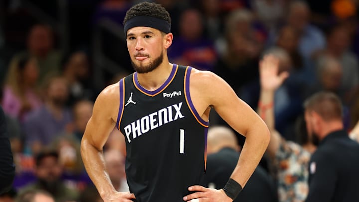 Apr 14, 2026; Phoenix, Arizona, USA; Phoenix Suns guard Devin Booker (1) reacts against the Portland Trail Blazers in the first half during the play-in rounds of the 2026 NBA Playoffs at Mortgage Matchup Center. Mandatory Credit: Mark J. Rebilas-Imagn Images