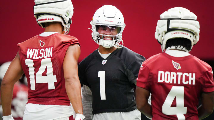 Arizona Cardinals quarterback Kyler Murray (1) practices with teammates Michael Wilson (14) and Greg Dortch (4) during the team's training camp session at State Farm Stadium in Glendale on July 24, 2024.