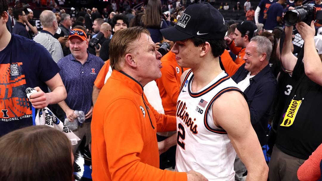 Mar 28, 2026; Houston, TX, USA; Illinois Fighting Illini head coach Brad Underwood and guard Andrej Stojakovic (2) celebrate after defeating the Iowa Hawkeyes in an Elite Eight game of the South Regional of the men's 2026 NCAA Tournament at Toyota Center. Mandatory Credit: Troy Taormina-Imagn Images